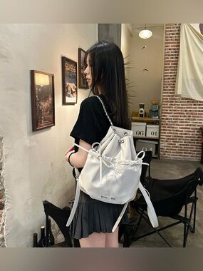Matin Kim White Leather Drawstring Ribbon Bucket Backpack